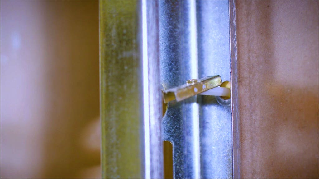 Inserting bolt into metal studs
